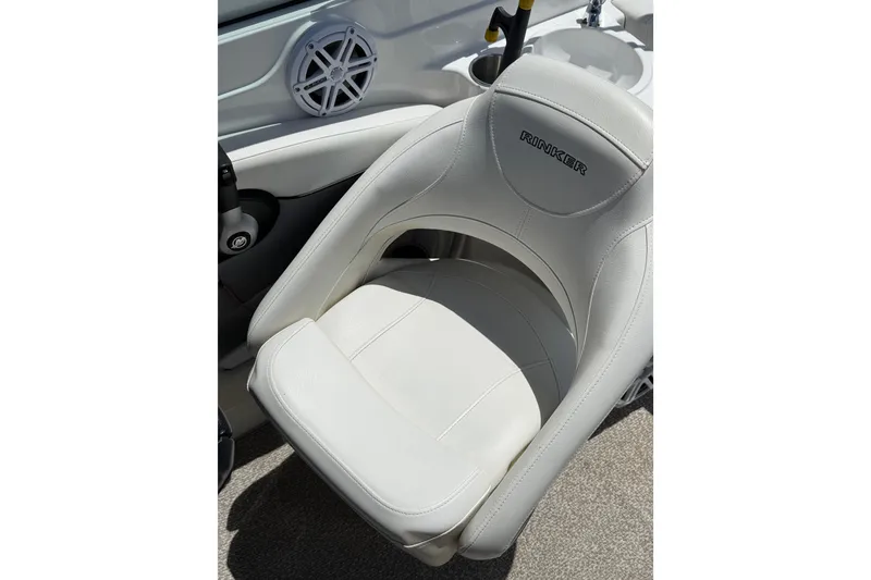 Slide: The Image of White leather seat on 2013 Rinker 246 Captiva Cuddy boat interior. - 15