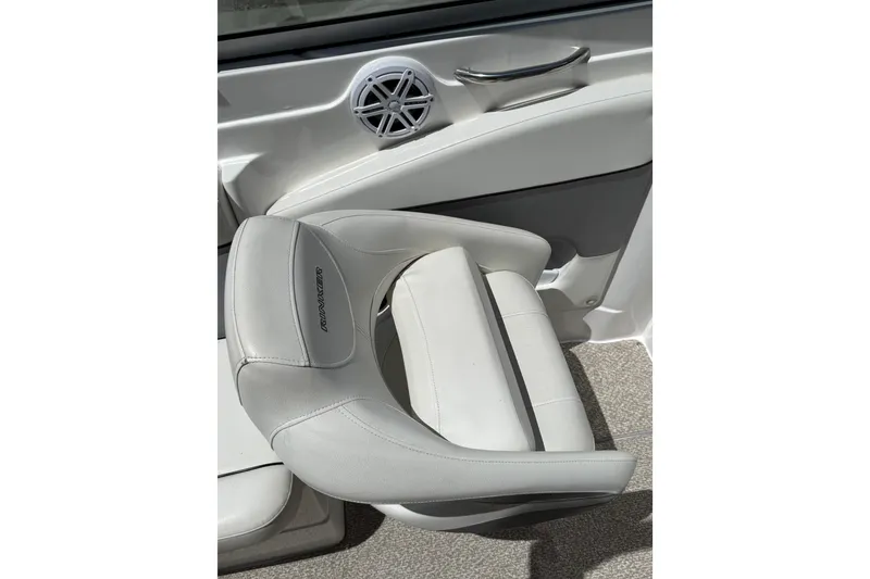 Slide: The Image of 2013 Rinker 246 Captiva Cuddy boat seat with speaker and handle detail. - 18