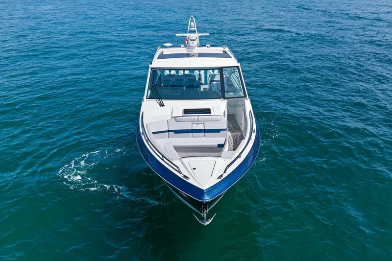 Slide: The Image of 2025 Formula 400 Super Sport Crossover boat on open water. - 10