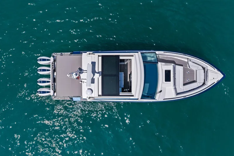 Slide: The Image of Aerial view of 2025 Formula 400 Super Sport Crossover yacht on clear blue water. - 11