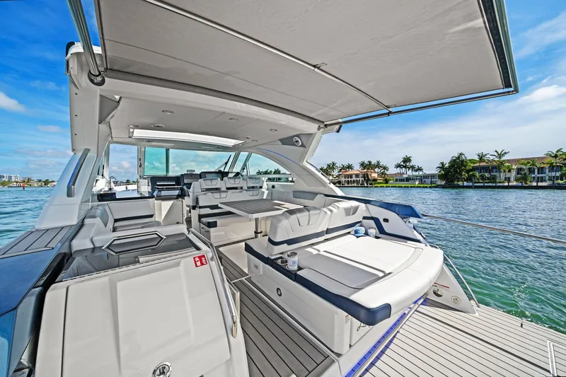 Slide: The Image of 2025 Formula 400 Super Sport Crossover yacht interior with luxurious seating and scenic waterfront view. - 18