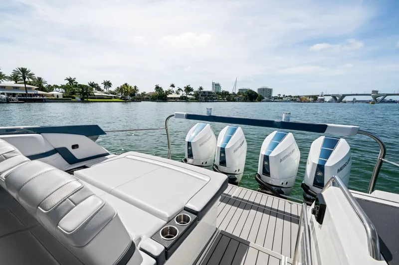 Slide: The Image of 2025 Formula 400 Super Sport Crossover boat with four powerful outboard engines on a sunny day. - 22