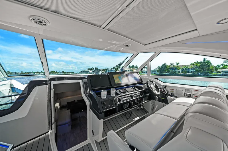 Slide: The Image of Luxurious interior of 2025 Formula 400 Super Sport Crossover yacht with modern helm and seating. - 25