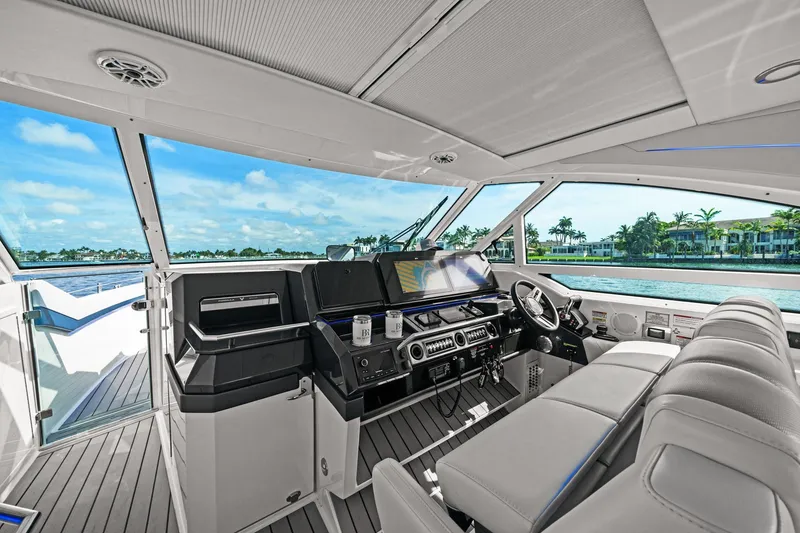 Slide: The Image of Interior of 2025 Formula 400 Super Sport Crossover yacht with modern helm and seating. - 26