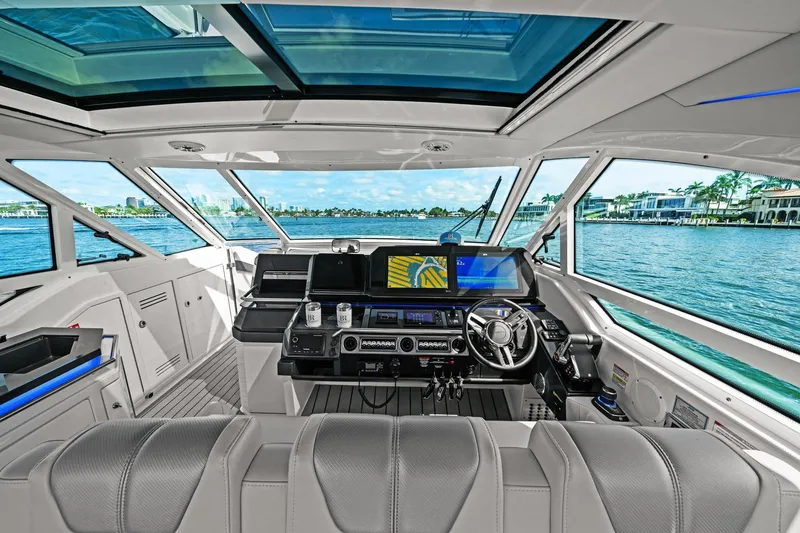 Slide: The Image of Interior view of 2025 Formula 400 Super Sport Crossover yacht cockpit with modern controls. - 27