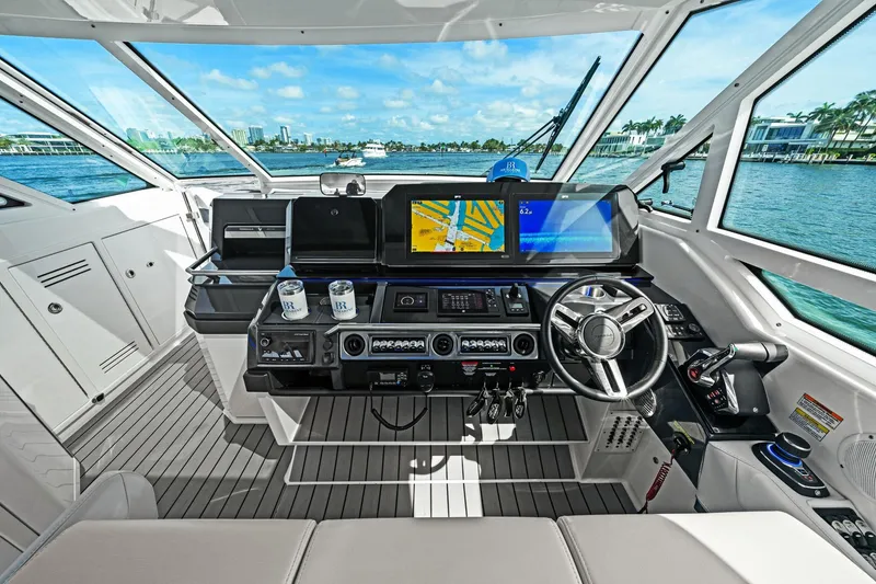 Slide: The Image of Helm of 2025 Formula 400 Super Sport Crossover with navigation screens and controls. - 28