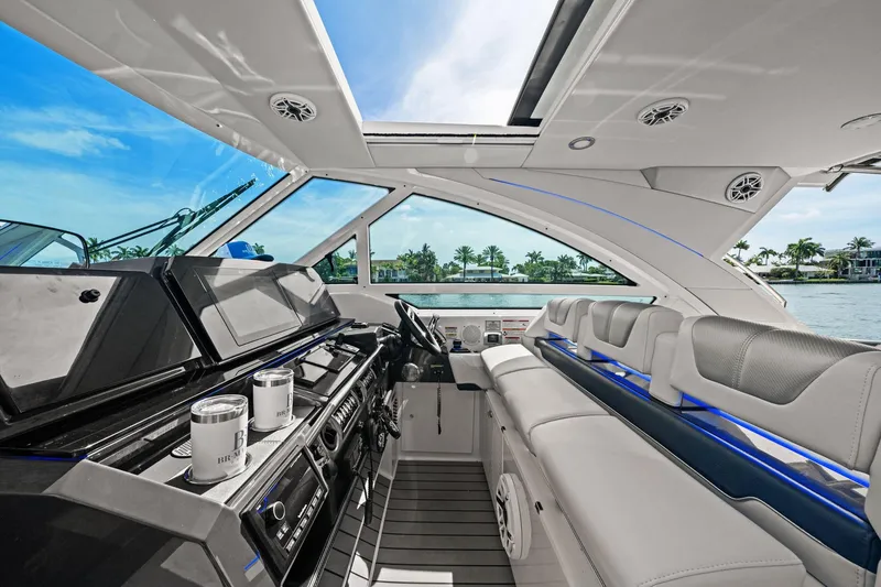 Slide: The Image of Luxurious interior of 2025 Formula 400 Super Sport Crossover yacht with modern seating and controls. - 30