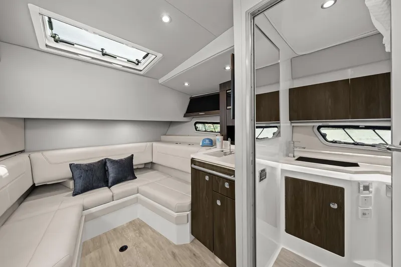 Slide: The Image of Luxurious interior of 2025 Formula 400 Super Sport Crossover yacht with modern seating and cabinetry. - 39