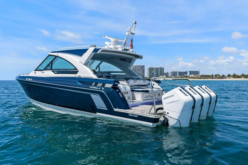 Slide: The Image of 2025 Formula 400 Super Sport Crossover boat on ocean, featuring sleek design and powerful engines. - 4