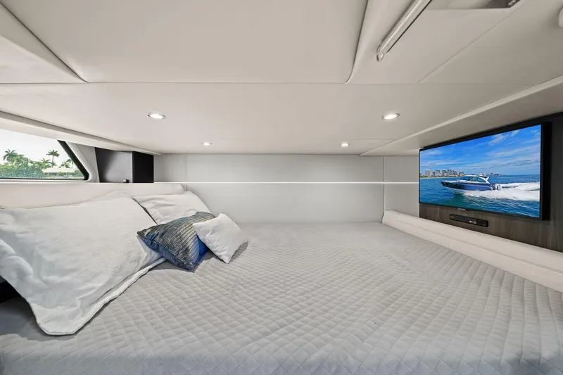 Slide: The Image of Luxurious cabin interior of 2025 Formula 400 Super Sport Crossover with TV and plush bedding. - 43
