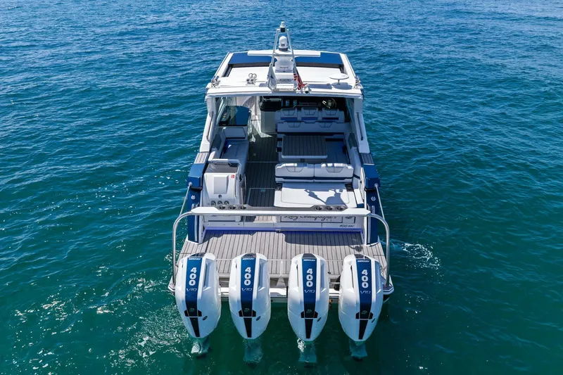Slide: The Image of 2025 Formula 400 Super Sport Crossover boat with four powerful engines on open water. - 5