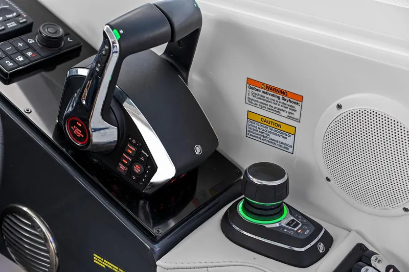 Slide: The Image of Control panel of 2025 Formula 400 Super Sport Crossover with joystick and throttle controls. - 50