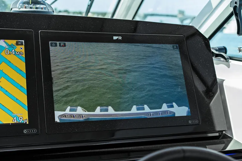Slide: The Image of Dashboard display of 2025 Formula 400 Super Sport Crossover showing navigation and rear camera. - 51