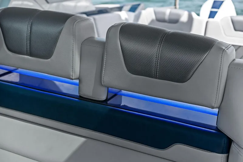 Slide: The Image of 2025 Formula 400 Super Sport Crossover interior seating with modern design and blue accent lighting. - 56