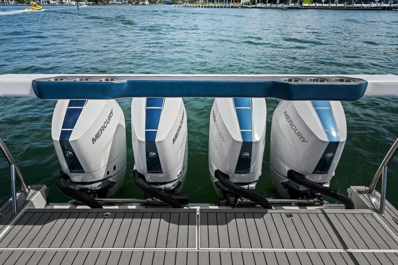Slide: The Image of 2025 Formula 400 Super Sport Crossover with four Mercury outboard engines on water. - 57