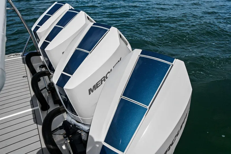 Slide: The Image of Four Mercury outboard engines on a 2025 Formula 400 Super Sport Crossover boat. - 58