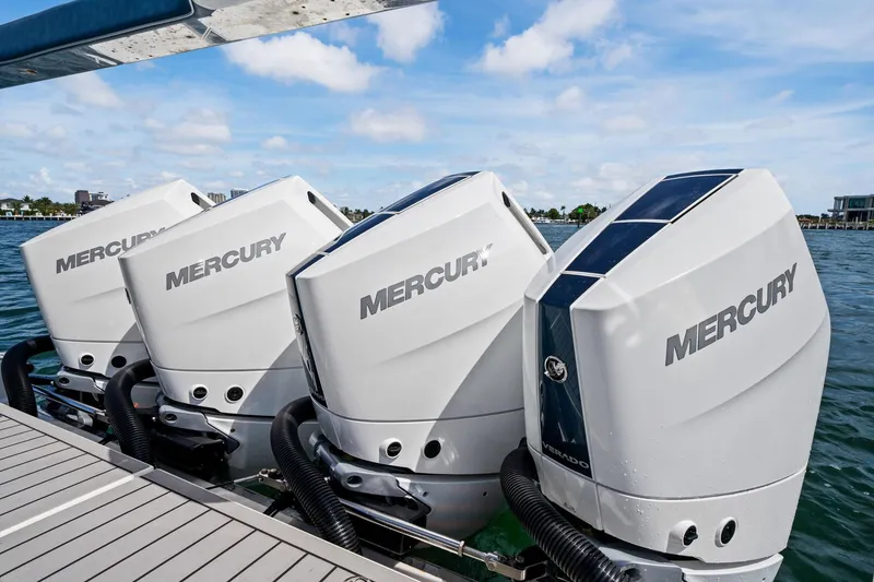 Slide: The Image of Four Mercury outboard engines on a 2025 Formula 400 Super Sport Crossover boat. - 59