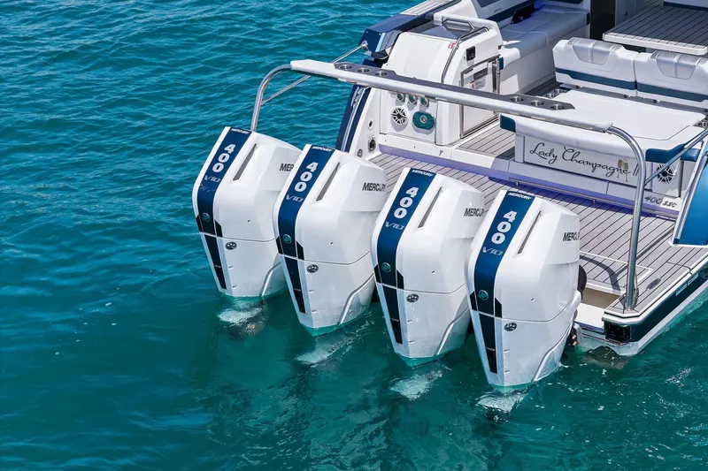 Slide: The Image of 2025 Formula 400 Super Sport Crossover with quad Mercury 400 V10 engines on turquoise water. - 62
