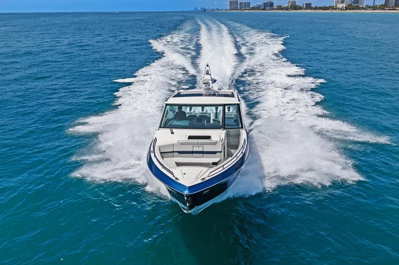 Slide: The Image of 2025 Formula 400 Super Sport Crossover cruising on open blue water. - 67