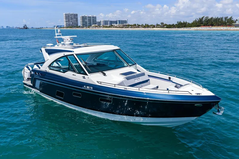 Slide: The Image of 2025 Formula 400 Super Sport Crossover yacht cruising on blue ocean waters. - 7