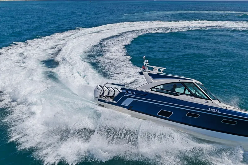 Slide: The Image of 2025 Formula 400 Super Sport Crossover cruising on open blue waters. - 72