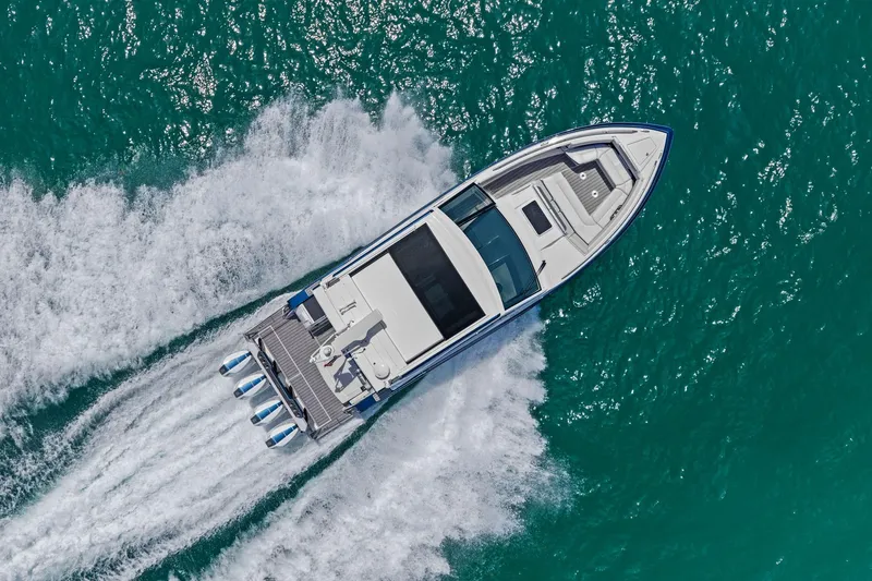 Slide: The Image of Aerial view of 2025 Formula 400 Super Sport Crossover speeding on turquoise water. - 79