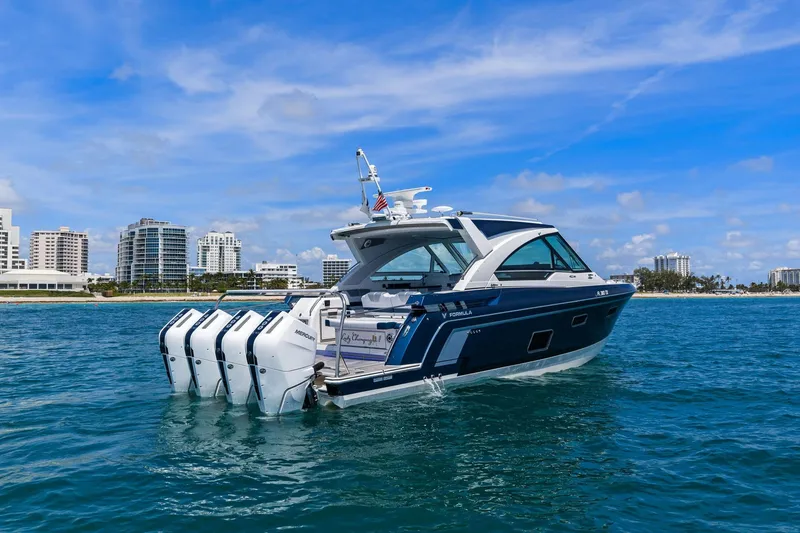 Slide: The Image of 2025 Formula 400 Super Sport Crossover yacht on blue ocean near city skyline. - 8
