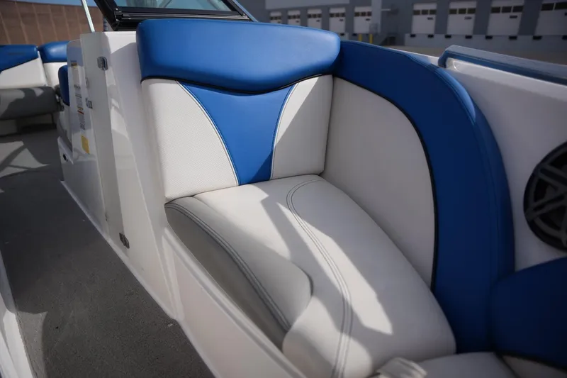 Slide: The Image of 2016 MasterCraft X10 boat interior with blue and white seating. - 10
