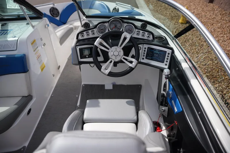 Slide: The Image of 2016 MasterCraft X10 boat interior with modern dashboard and steering wheel. - 13
