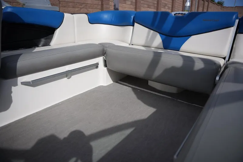 Slide: The Image of 2016 MasterCraft X10 boat interior with blue and gray seating, showcasing modern design. - 15