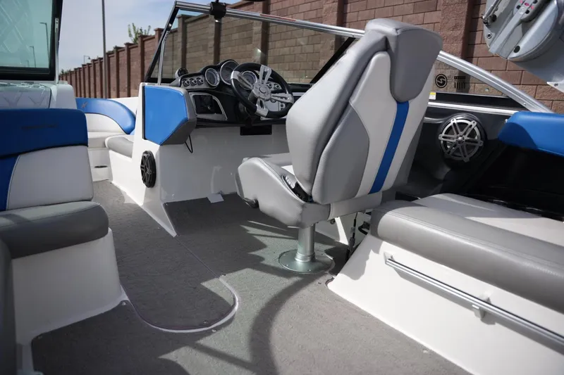 Slide: The Image of Interior of a 2016 MasterCraft X10 boat with blue and gray seating. - 16