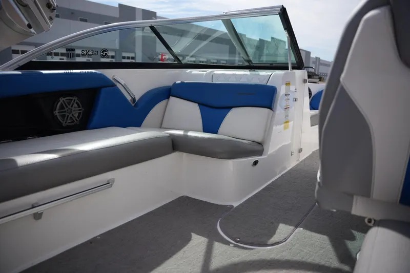 Slide: The Image of 2016 MasterCraft X10 boat interior with blue and gray seating, modern design. - 17