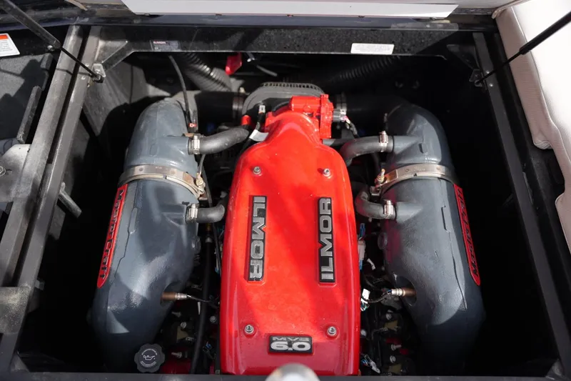 Slide: The Image of 2016 MasterCraft X10 Ilmor MV8 6.0 engine, red and gray components, top view. - 20