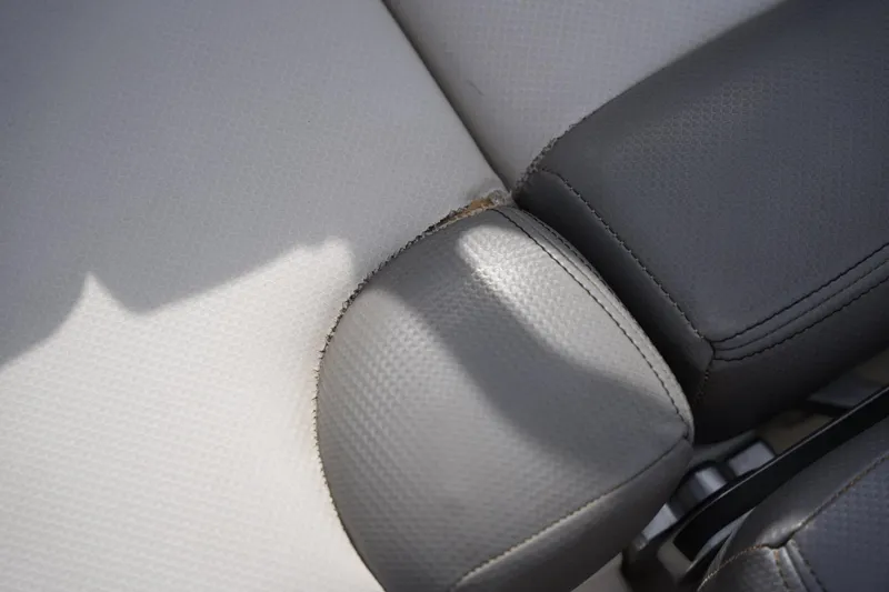 Slide: The Image of Close-up of 2016 MasterCraft X10 boat seat with visible wear and tear. - 21