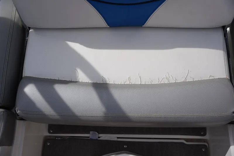 Slide: The Image of Worn seat upholstery on 2016 MasterCraft X10 boat, showing visible cracking and wear. - 22