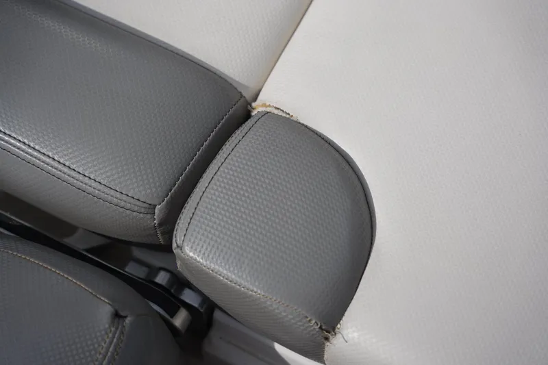 Slide: The Image of Close-up of 2016 MasterCraft X10 boat seat with gray and white upholstery. - 23