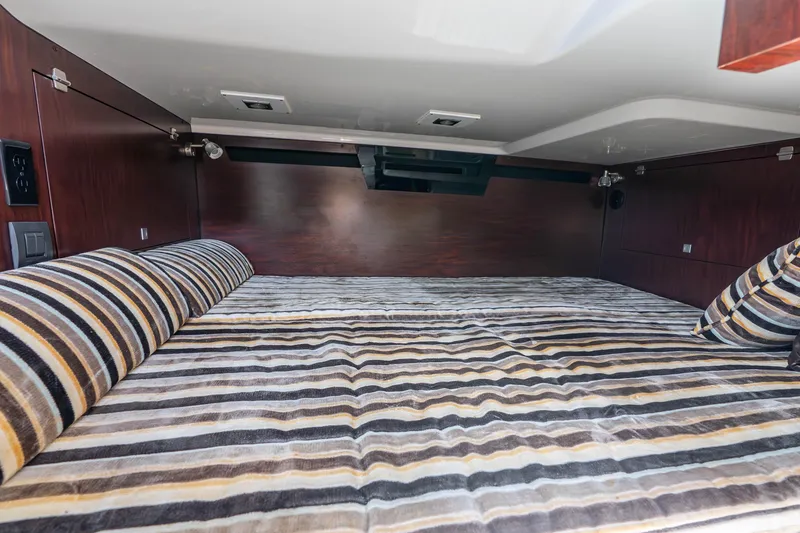 Slide: The Image of Interior cabin of 2022 Monterey 378SS Super Sport with striped bedding. - 14