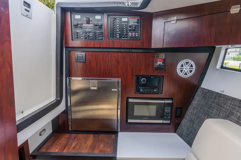 Slide: The Image of Interior of 2022 Monterey 378SS Super Sport boat with control panel and appliances. - 15