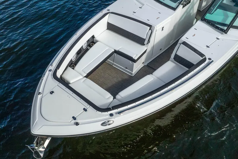 Slide: The Image of 2022 Monterey 378SS Super Sport boat with spacious seating on calm water. - 18
