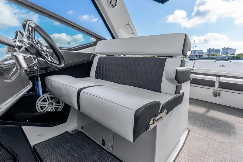 Slide: The Image of Interior of 2022 Monterey 378SS Super Sport boat with luxurious seating and steering wheel. - 26