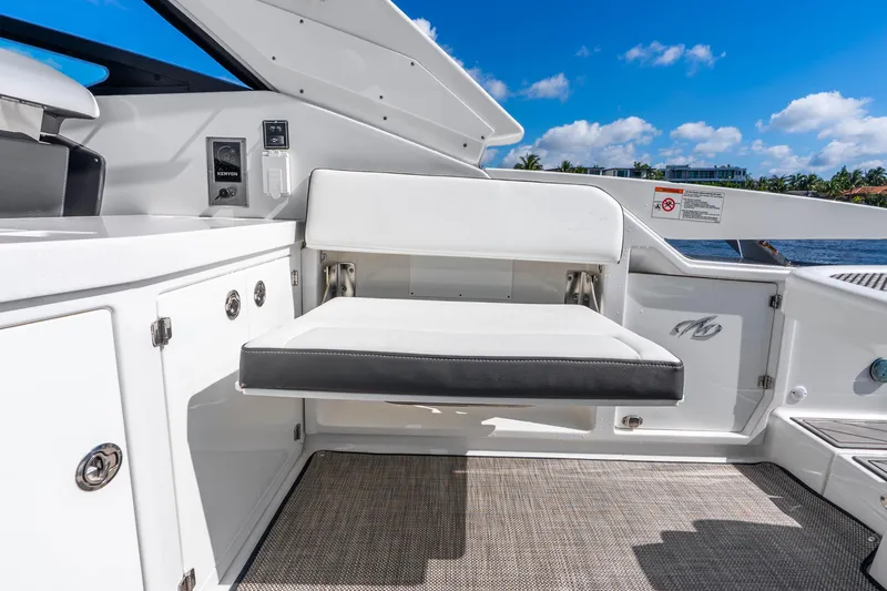 Slide: The Image of 2022 Monterey 378SS Super Sport boat interior with white seating and cabinetry. - 34