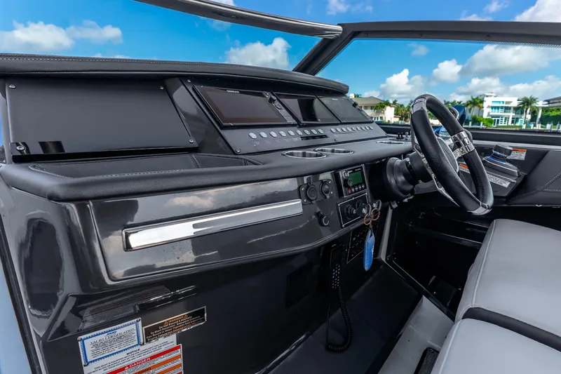 Slide: The Image of Cockpit of 2022 Monterey 378SS Super Sport boat with modern controls and steering wheel. - 9