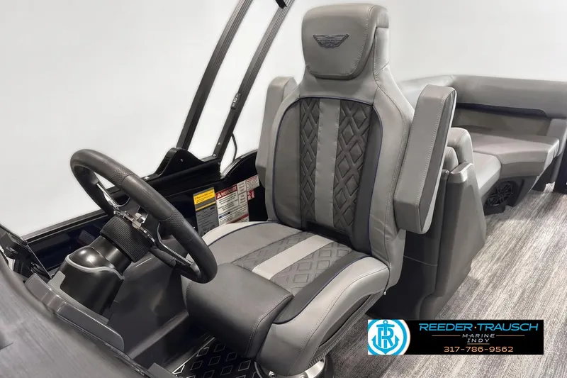 Slide: The Image of Captain's chair and steering wheel of 2026 Bennington 24 MFB boat, featuring luxury design. - 3