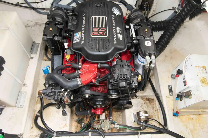 Slide: The Image of Engine compartment of a 2006 Larson Cabrio 240 boat featuring a Volvo Penta 5.0 GXI engine. - 13