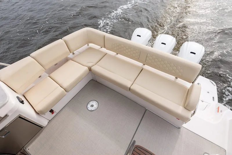 Slide: The Image of Manufacturer Provided Image: Luxurious seating on 2026 Regal 42 FXO boat with triple outboard engines. - 4