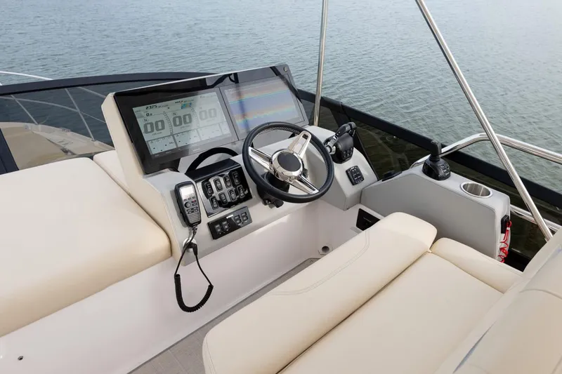 Slide: The Image of Manufacturer Provided Image: Helm of 2026 Regal 42 FXO yacht with modern controls and navigation system. - 6