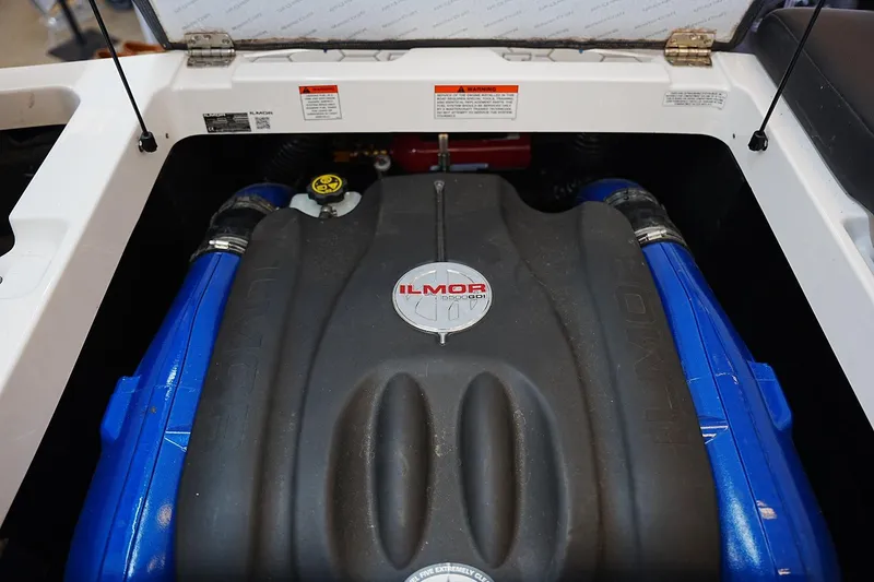 Slide: The Image of 2019 MasterCraft NXT22 engine compartment featuring Ilmor engine components. - 15
