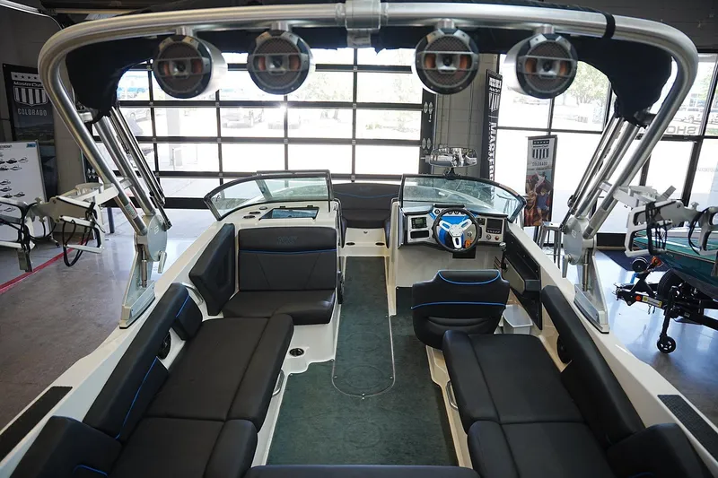 Slide: The Image of 2019 MasterCraft NXT22 boat interior with sleek seating and advanced dashboard. - 16