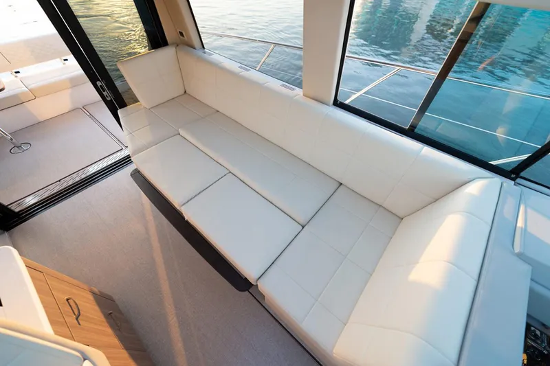 Slide: The Image of Manufacturer Provided Image: Luxurious interior of 2026 Regal 42 XO yacht with white leather seating. - 10