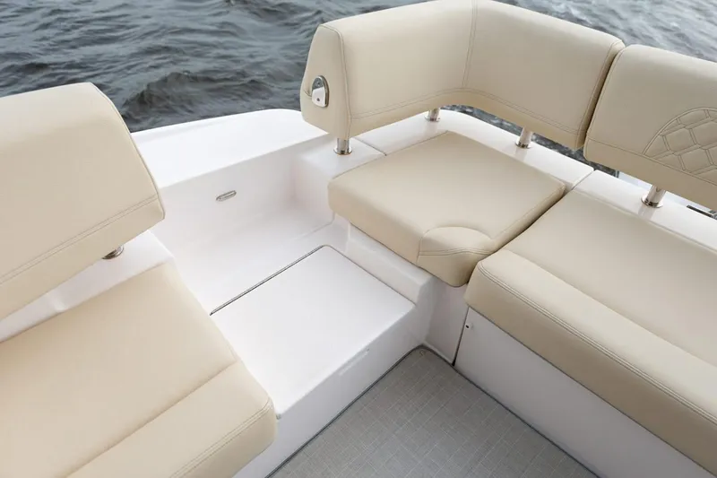 Slide: The Image of Manufacturer Provided Image: Luxurious seating on 2026 Regal 42 XO yacht, featuring beige cushions and sleek design. - 4